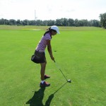 Young junior standing taller to limit arm swing